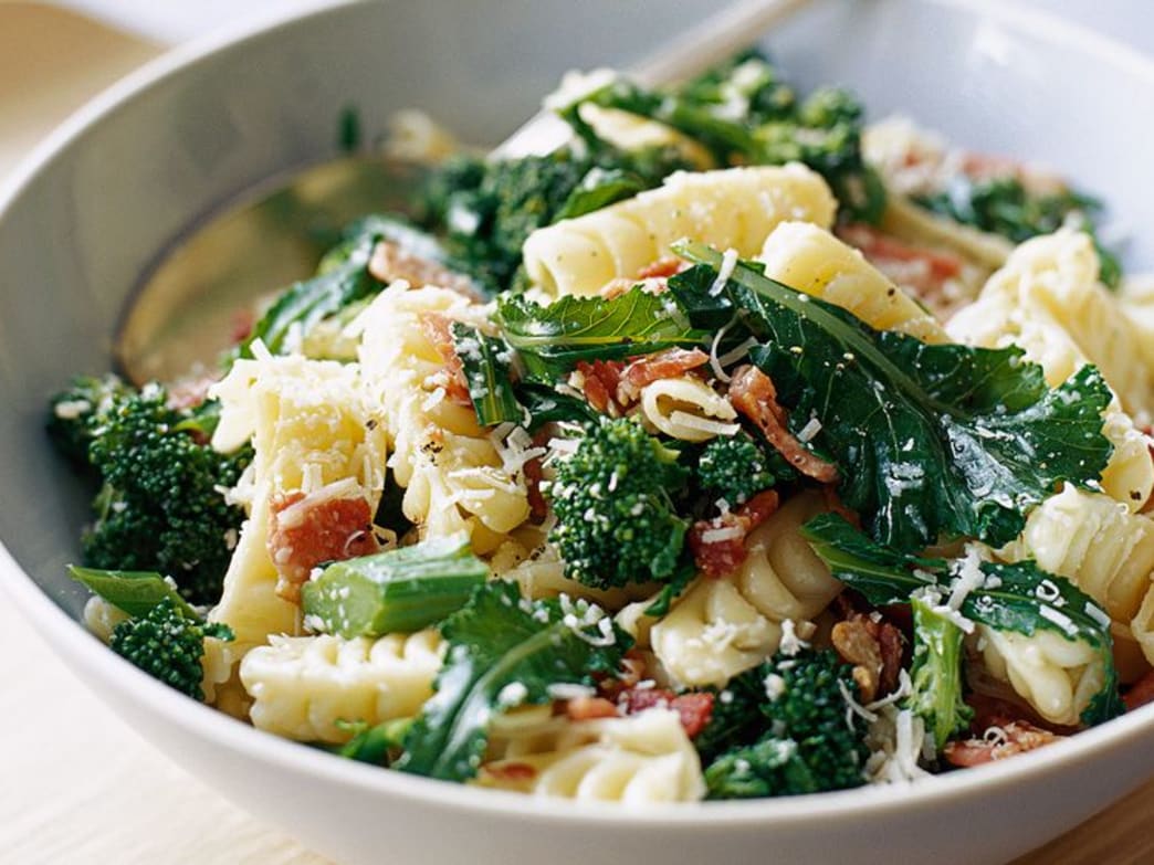 Bowl of festoni pasta with broccoli, bacon, and parmesan cheese