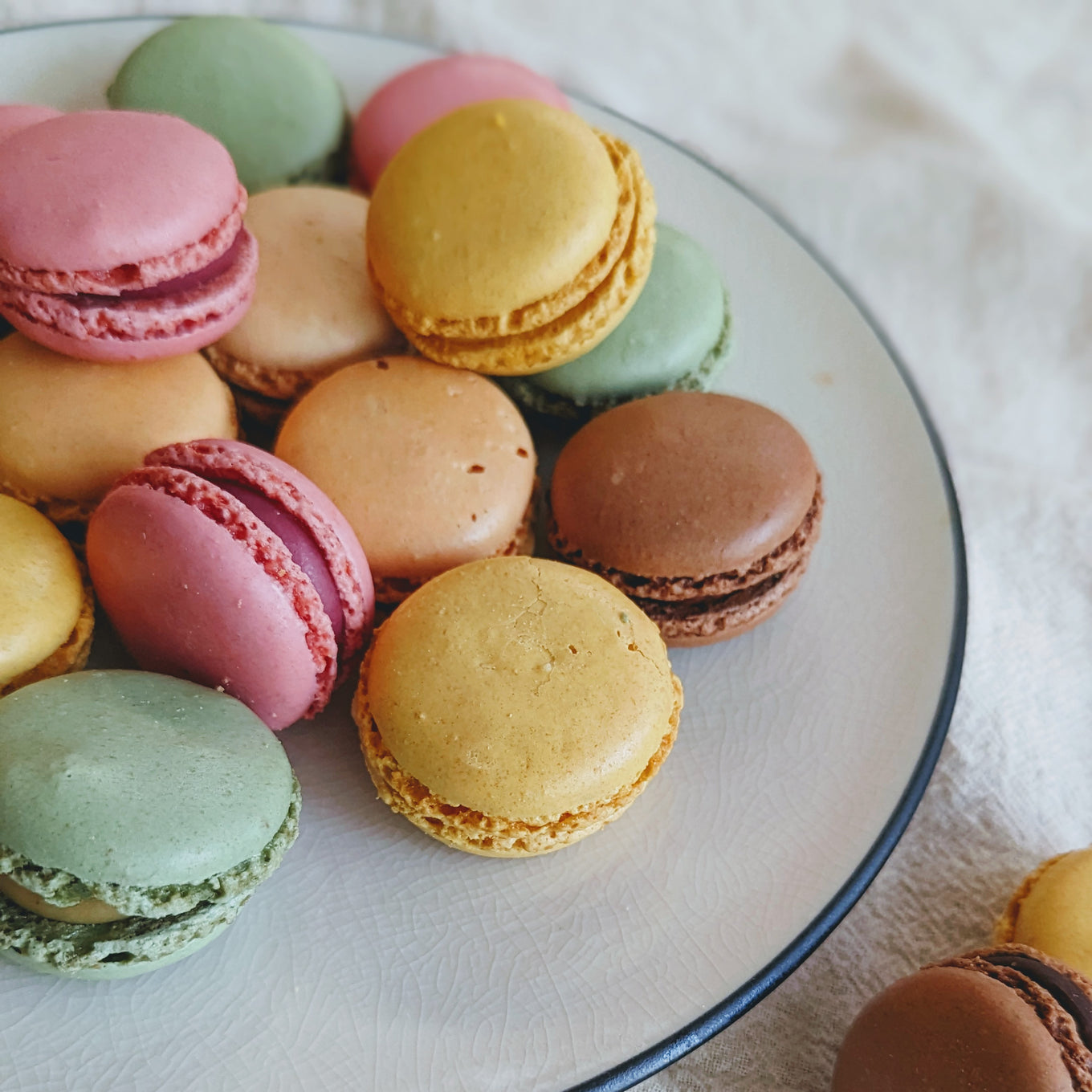Colorful macarons in various flavors on a plate