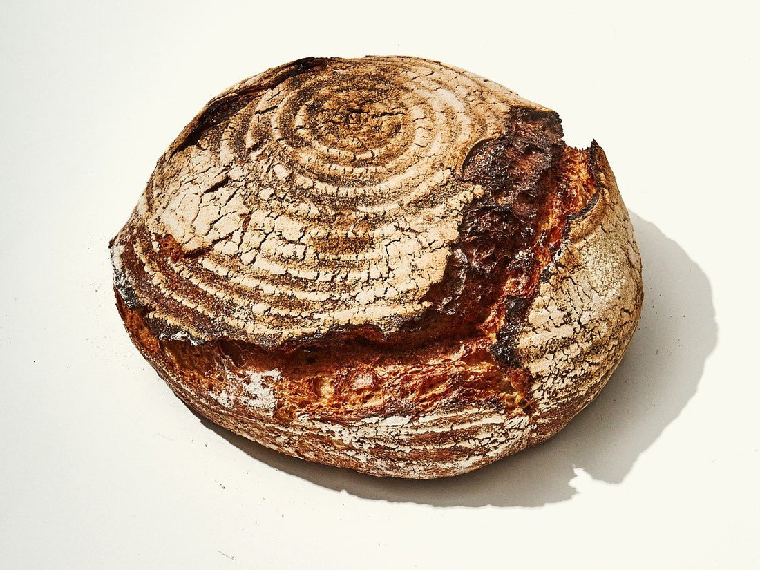 Artisan sourdough bread with a crusty exterior and spiral pattern