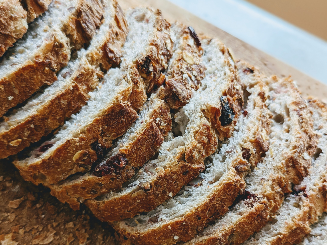 Close-up of sliced whole grain bread with seeds and nuts
