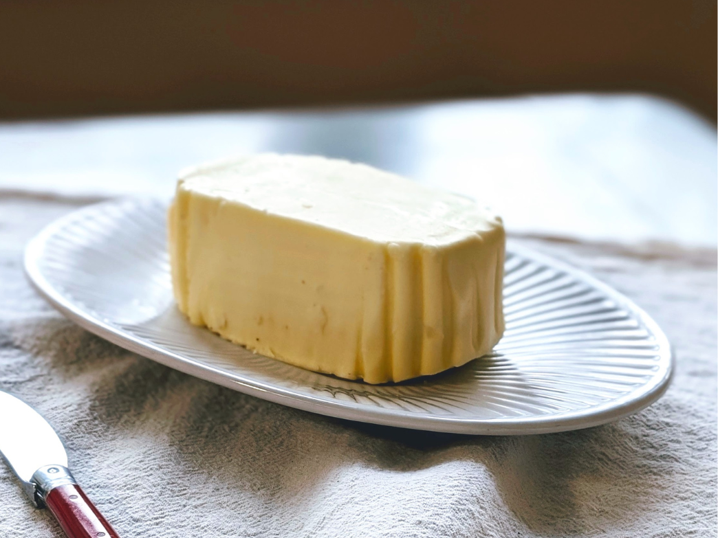 A block of butter on a plate