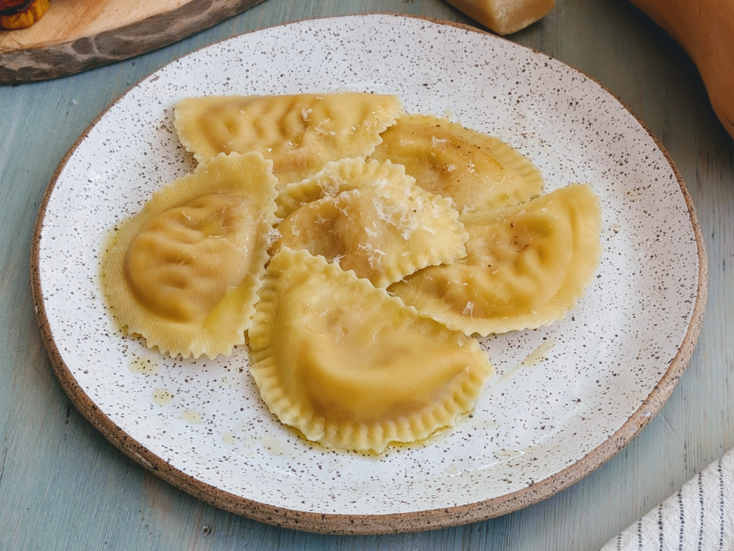 Plate of ravioli with a light drizzle of oil