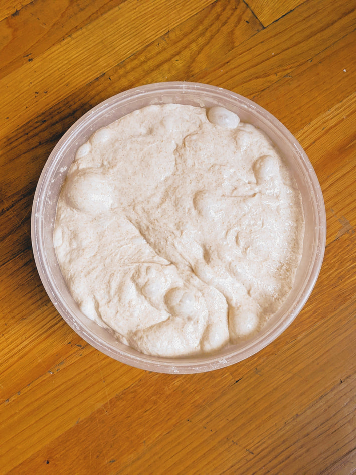 Bowl of slow-fermented dough for 3-seed bread