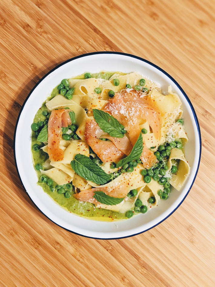Pappardelle pasta with peas, salmon, and mint in a creamy sauce