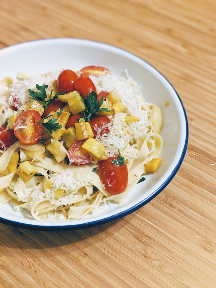 Pappardelle pasta with cherry tomatoes, mango, and parsley