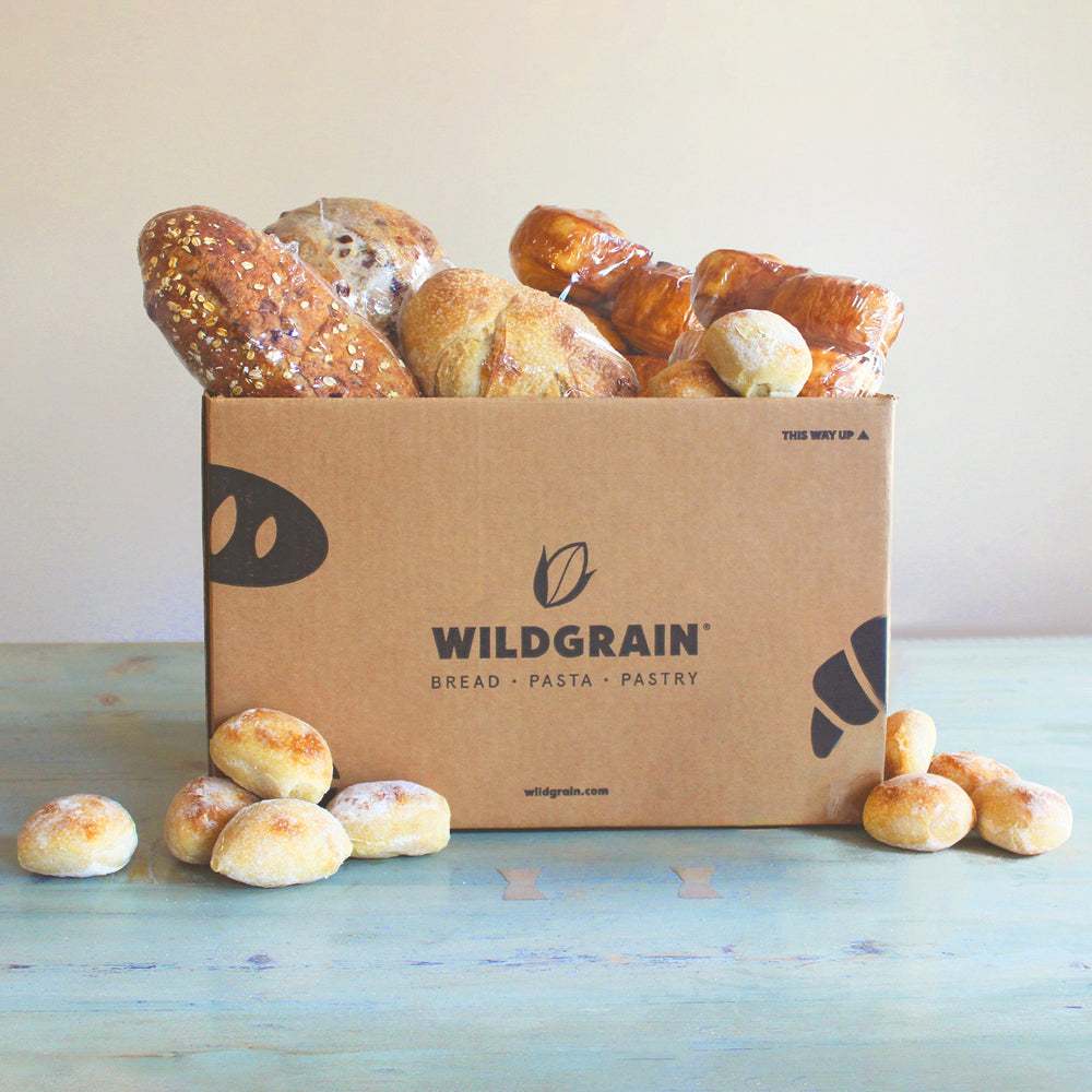 A box filled with various gluten-free breads and pastries from Wildgrain.