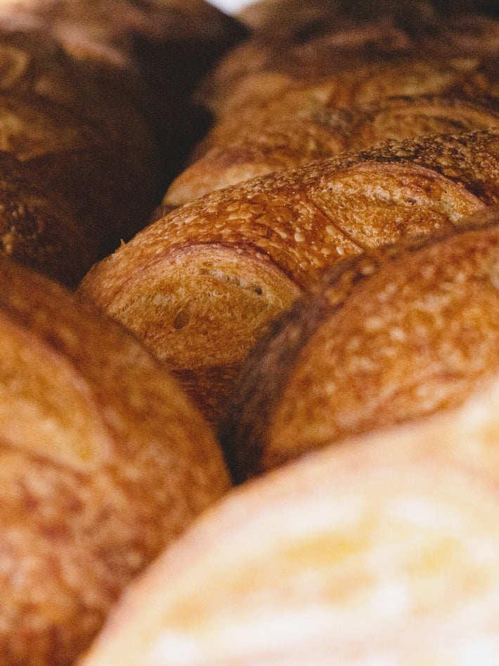 Close-up of artisanal bread loaves with a golden crust
