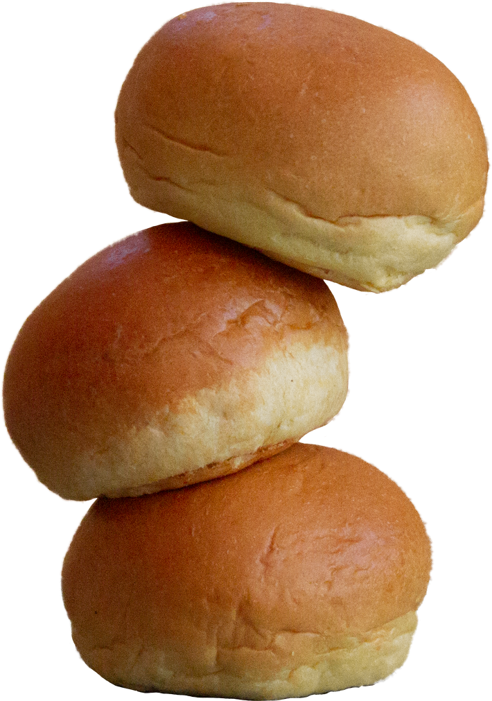 Three slow-fermented brioche rolls stacked on top of each other