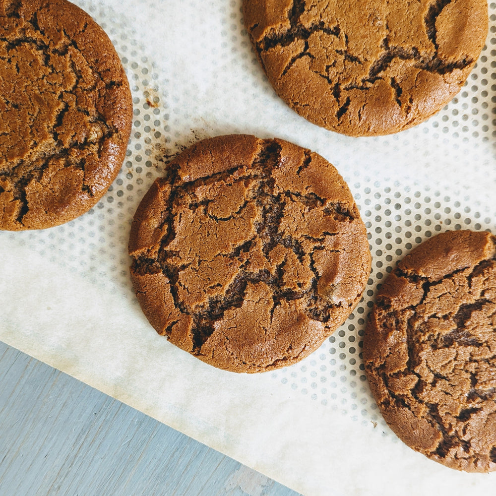 Gluten-Free Giant Ginger Molasses Cookies on parchment paper