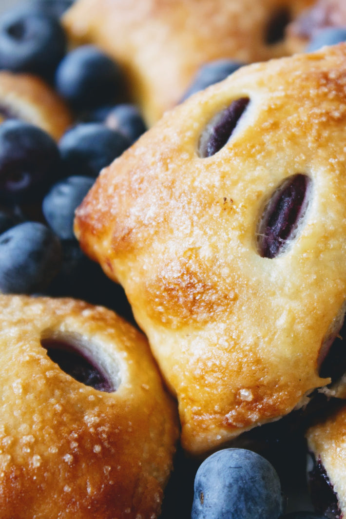 Close-up of Wildgrain Blueberry Pie Bites with blueberries