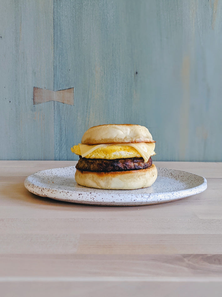 English muffin sandwich with egg and cheese on a plate