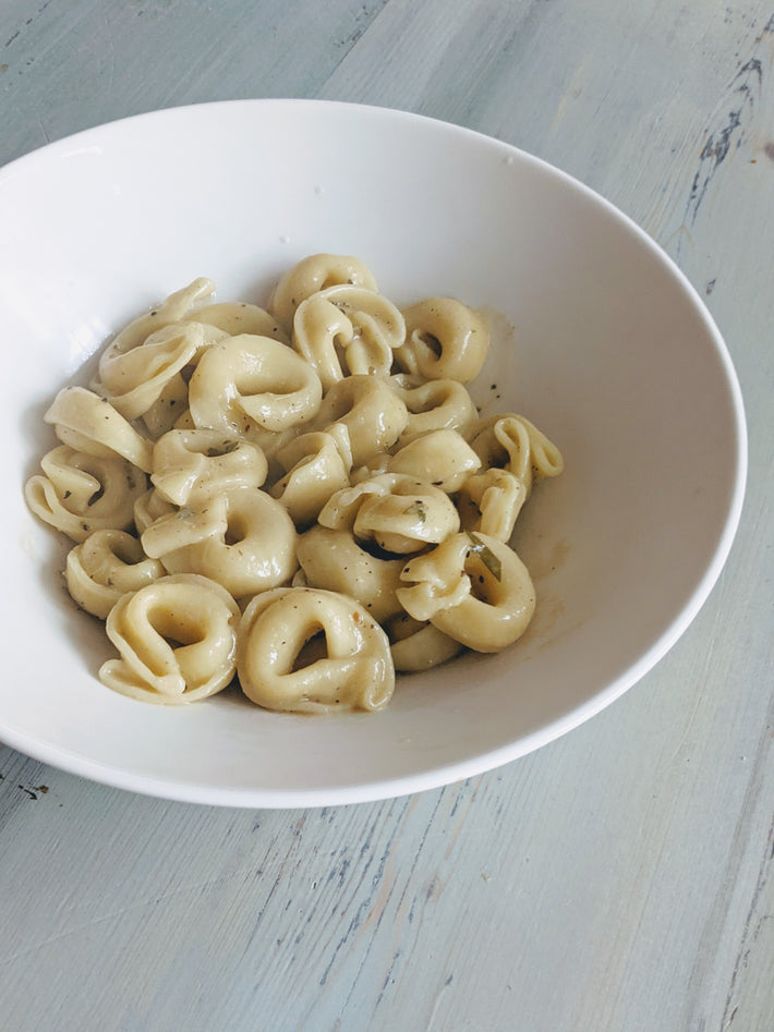 Cheese Tortellini in a white bowl