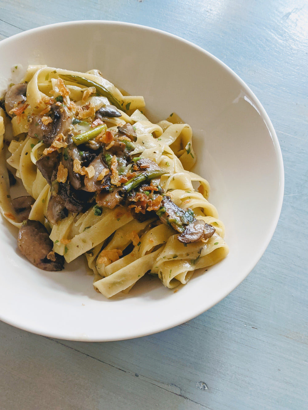 Wildgrain Fettucine with mushrooms and asparagus in a bowl