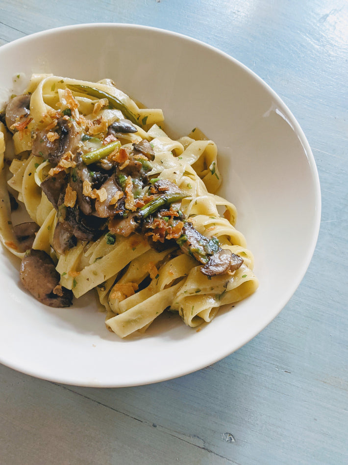 Wildgrain Fettucine with mushrooms and asparagus in a bowl