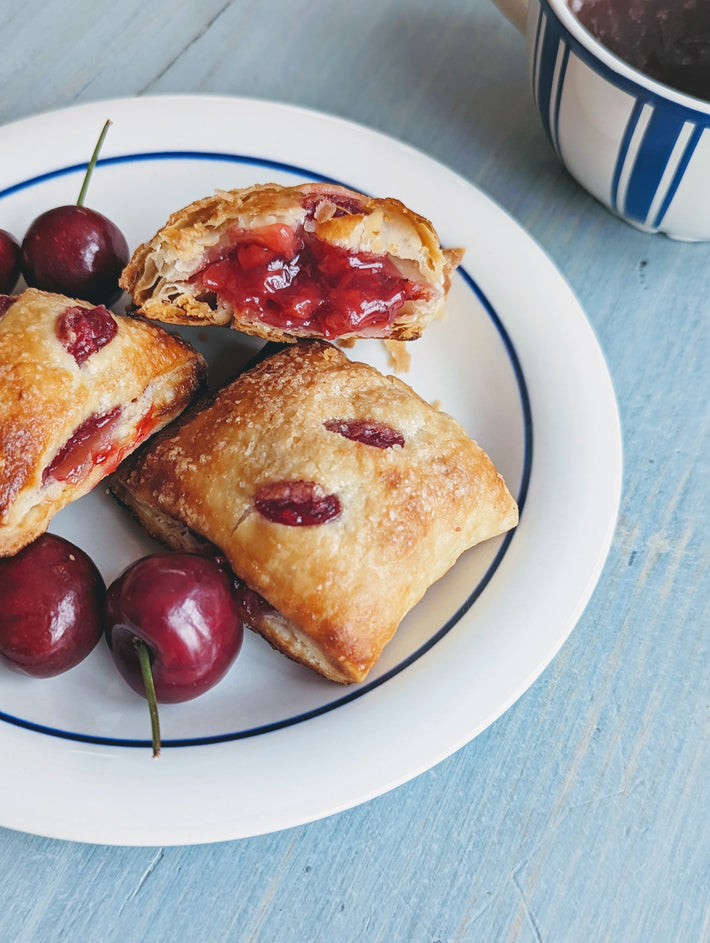 Cherry Pie Bites with cherries on a plate