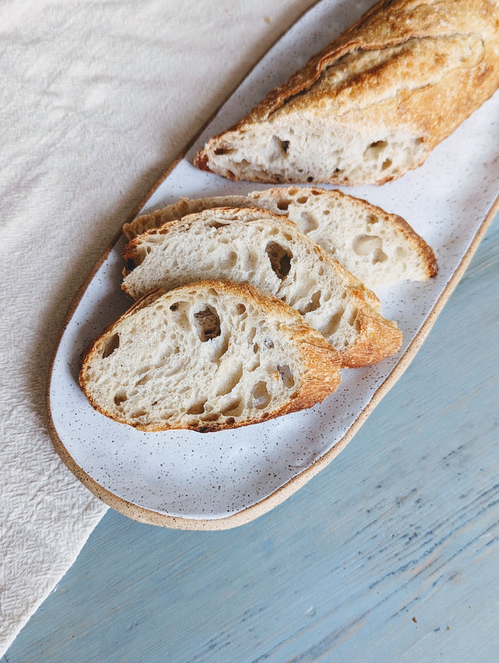 Slices of crusty sourdough bread on a plate