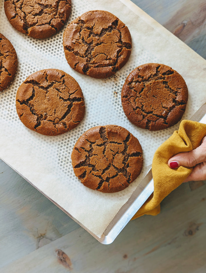 Freshly baked Giant Ginger Molasses Cookies on a baking sheet