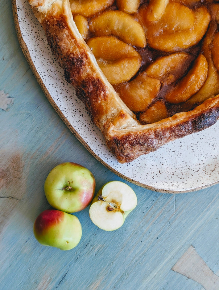 Apple caramel galette with sliced apples on a plate