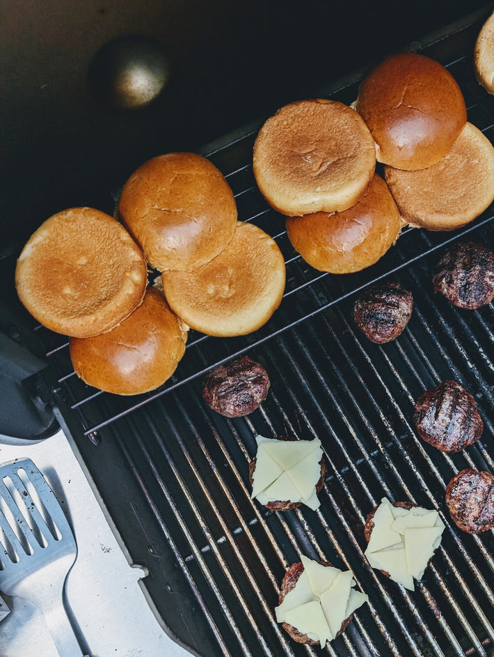 Grilled burger buns on a grill