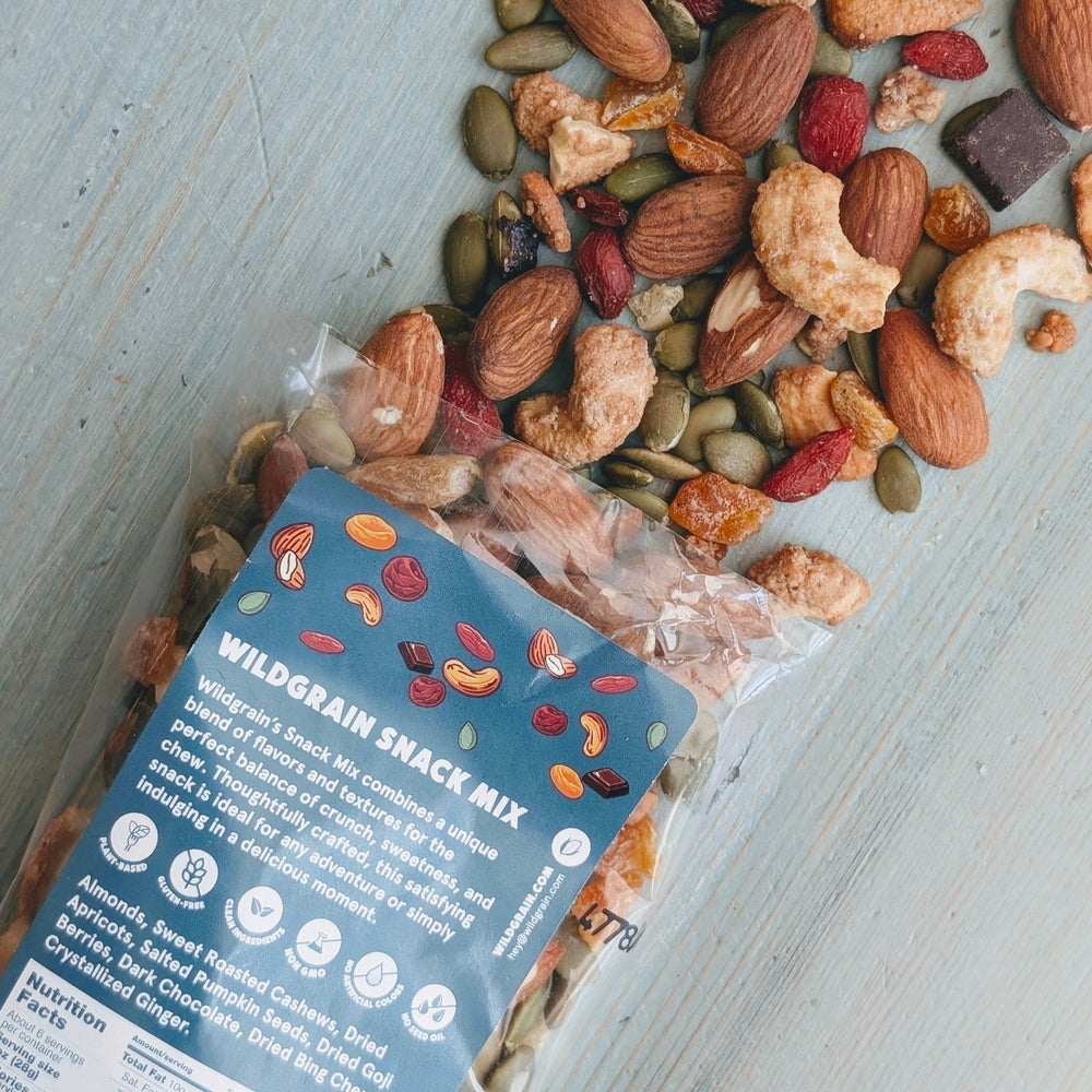 Wildgrain snack mix with a blue label on a light wooden surface