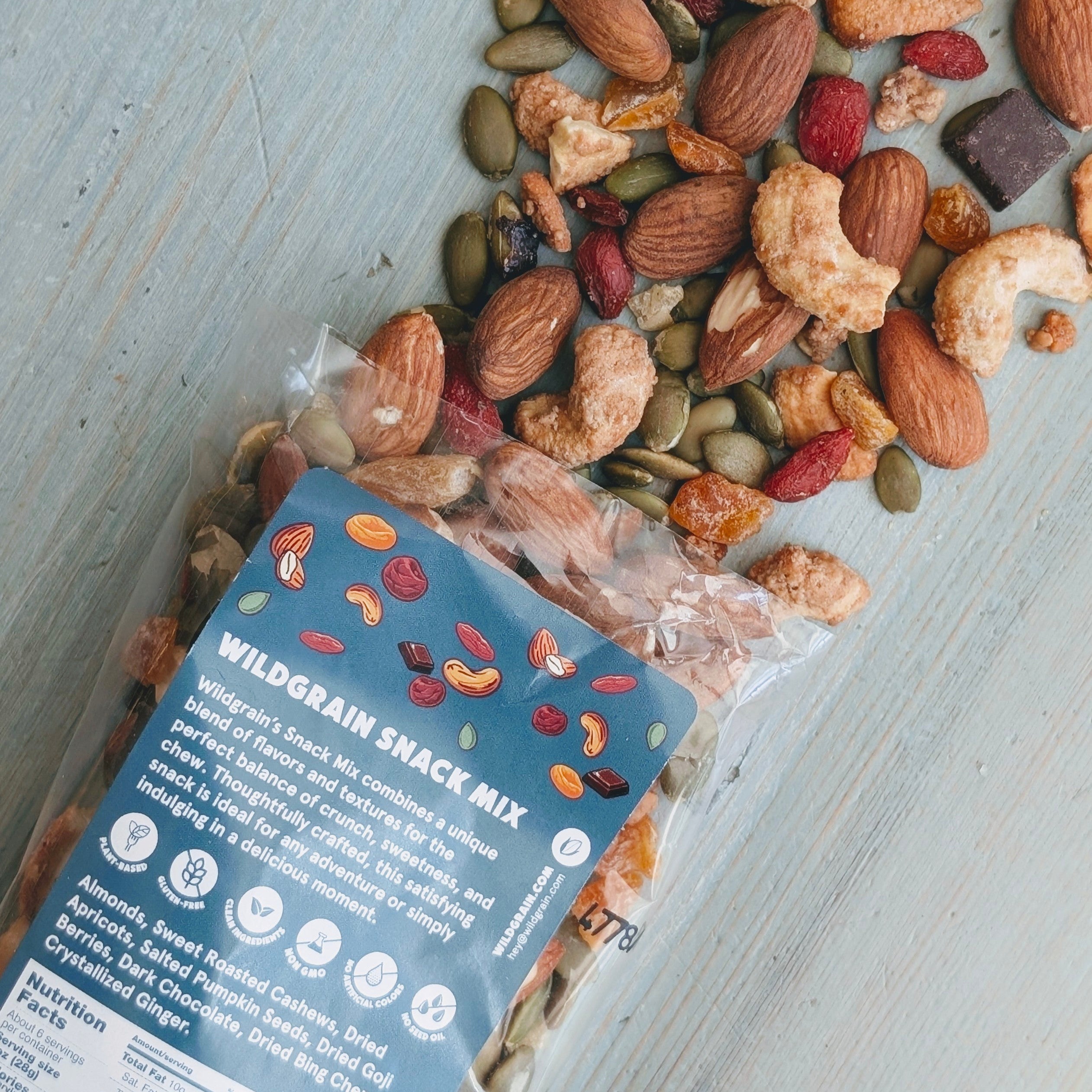 Wildgrain snack mix with a blue label on a light wooden surface