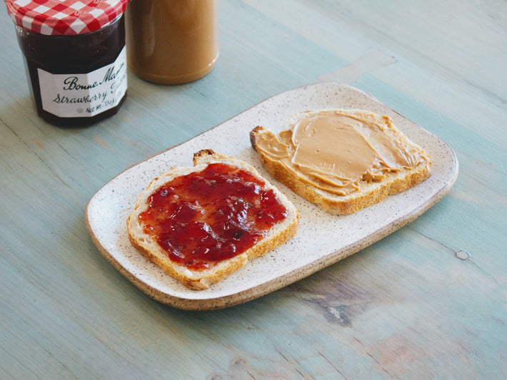 Toast with peanut butter and jelly on a plate