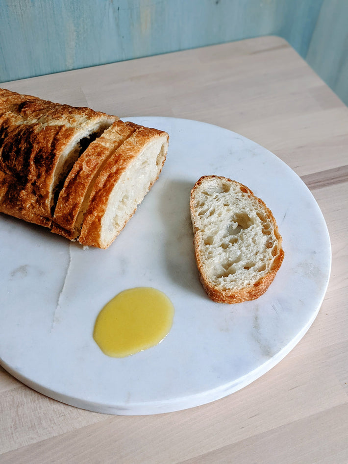 Wildgrain Olive Oil Ciabatta with olive oil on a marble plate